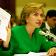 First lady Hillary Rodham Clinton holds up a pamphlet entitled "Coronary Artery Bypass Graft Surgery" while testifying on Capitol Hill before the House Energy Committee, Sept. 28, 1993. The committee was holding hearings on health care reform.